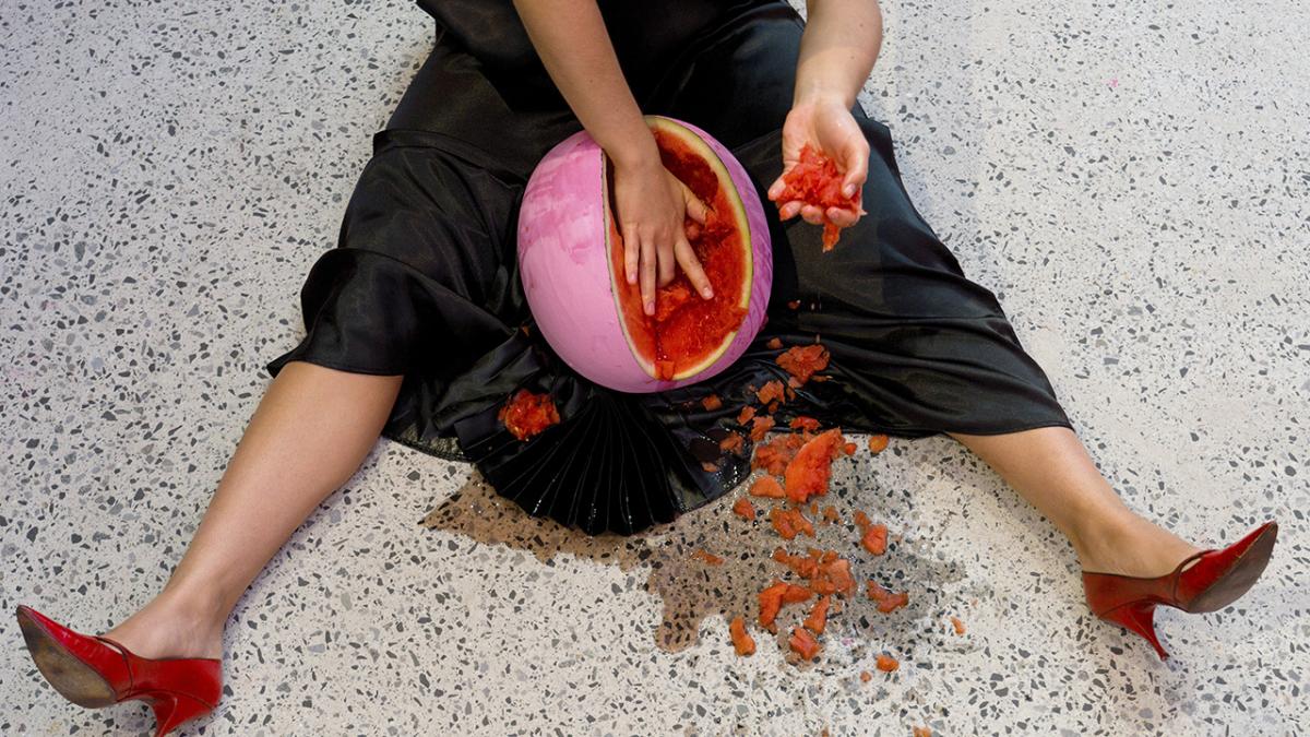 woman gouges a watermelon