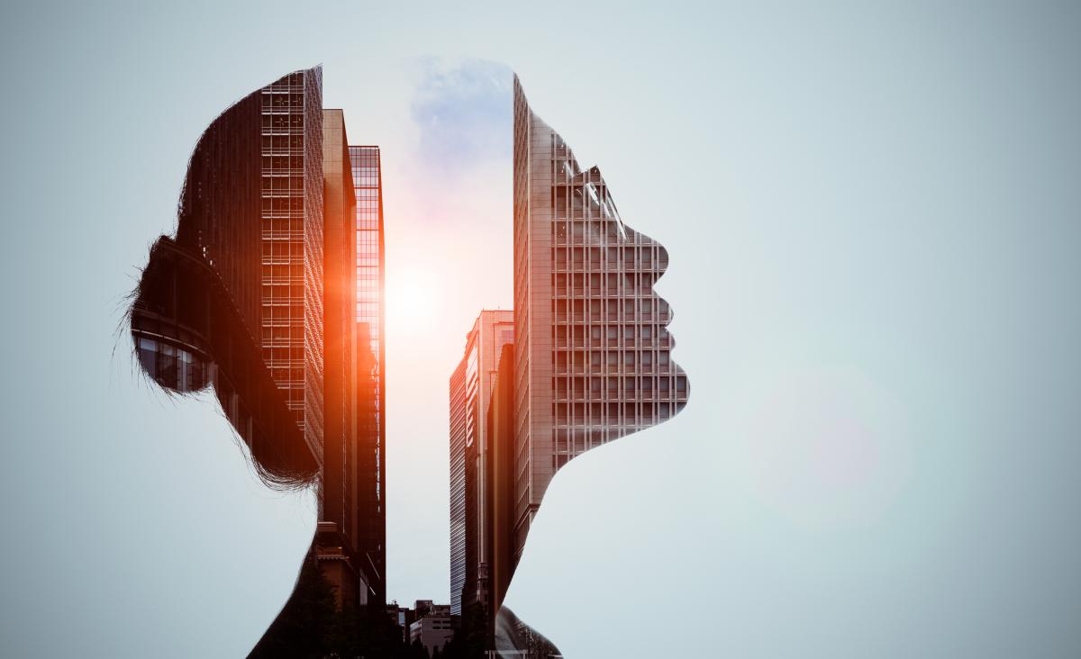 Double exposure of woman silhouette and modern city skyline images