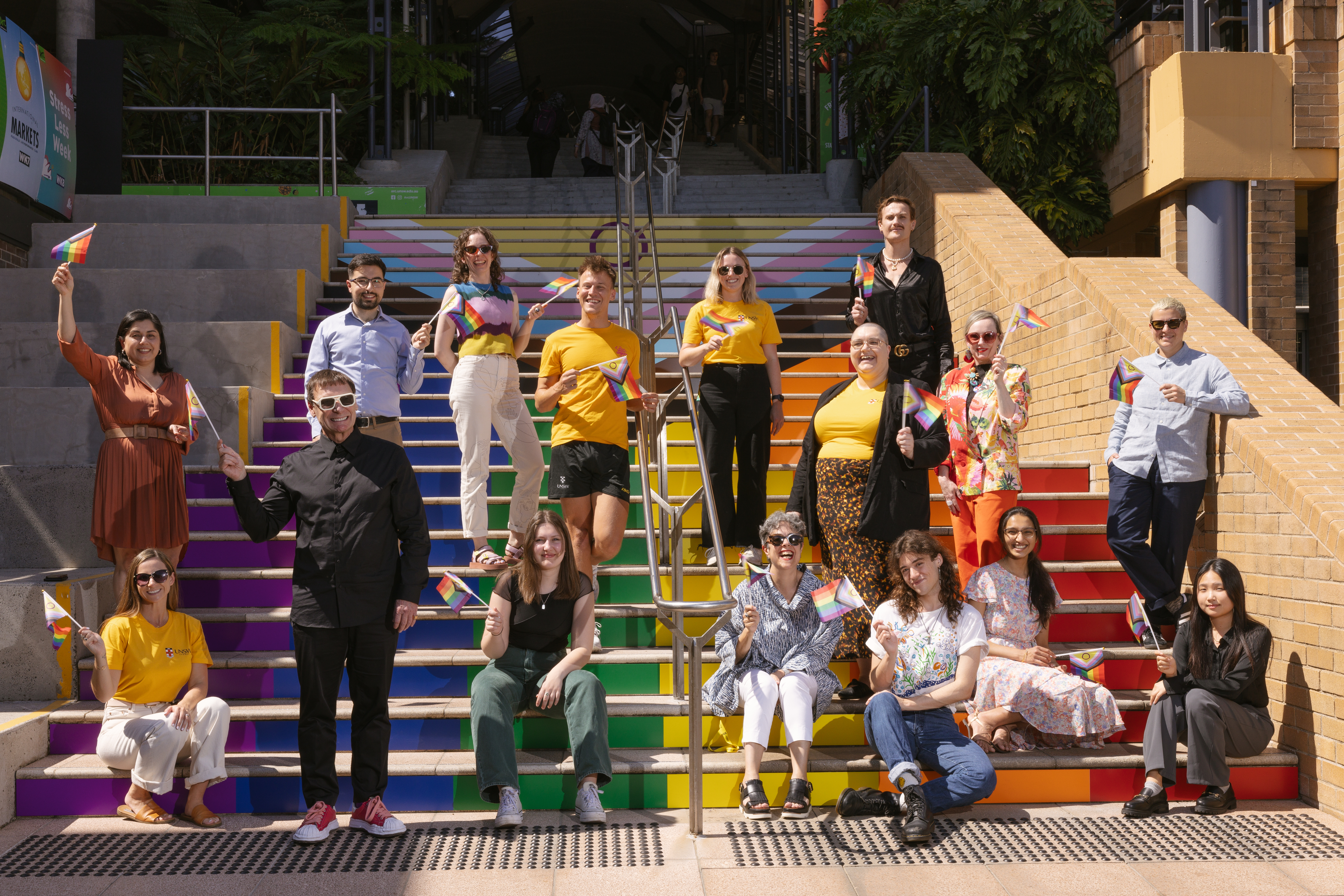 An image of people smiling at the Basser Steps on UNSW's Kensington Campus, which were redesigned for Diversity Festival 2023.