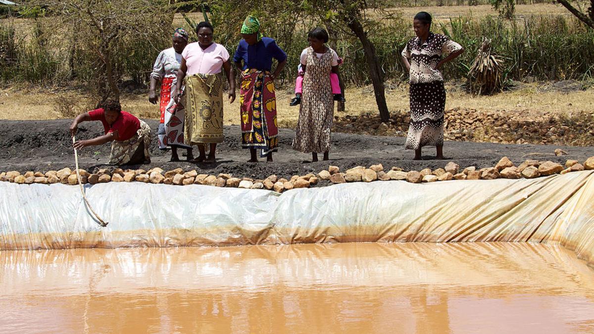 photo of women along the bank of a river in Kenya