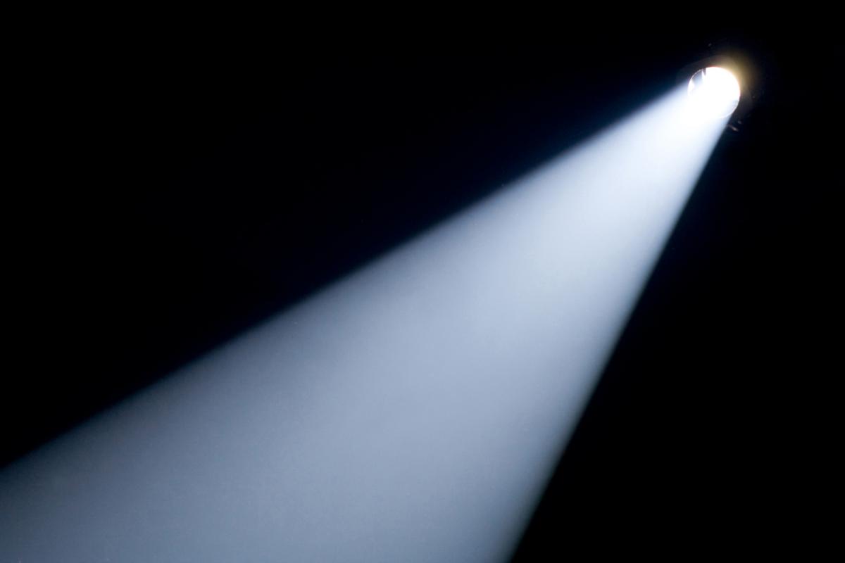 photo of a light beam against a black background