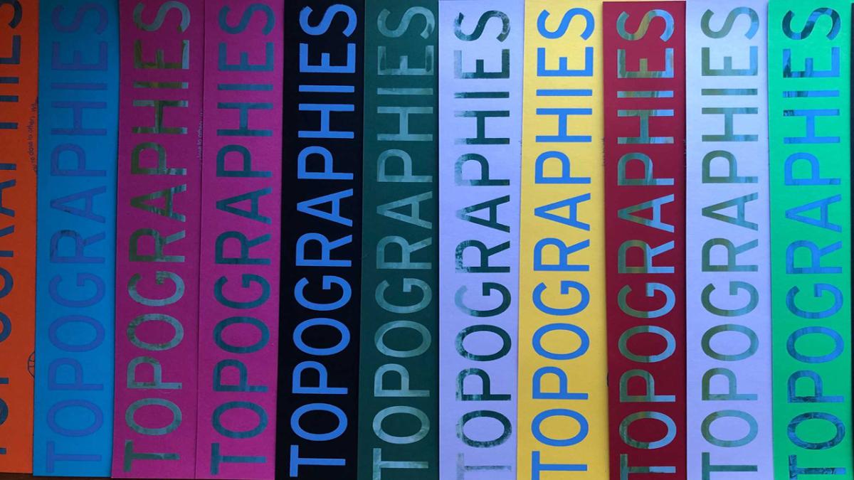 Book spines with 'Topographies' on the spine. 