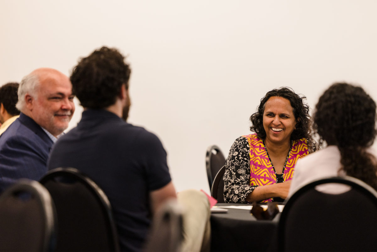 UNSW academics chatting and smiling
