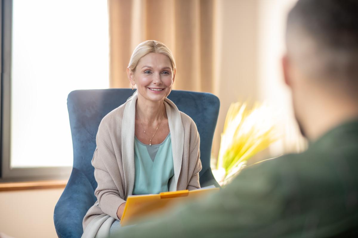 A female psychologist talking to a client
